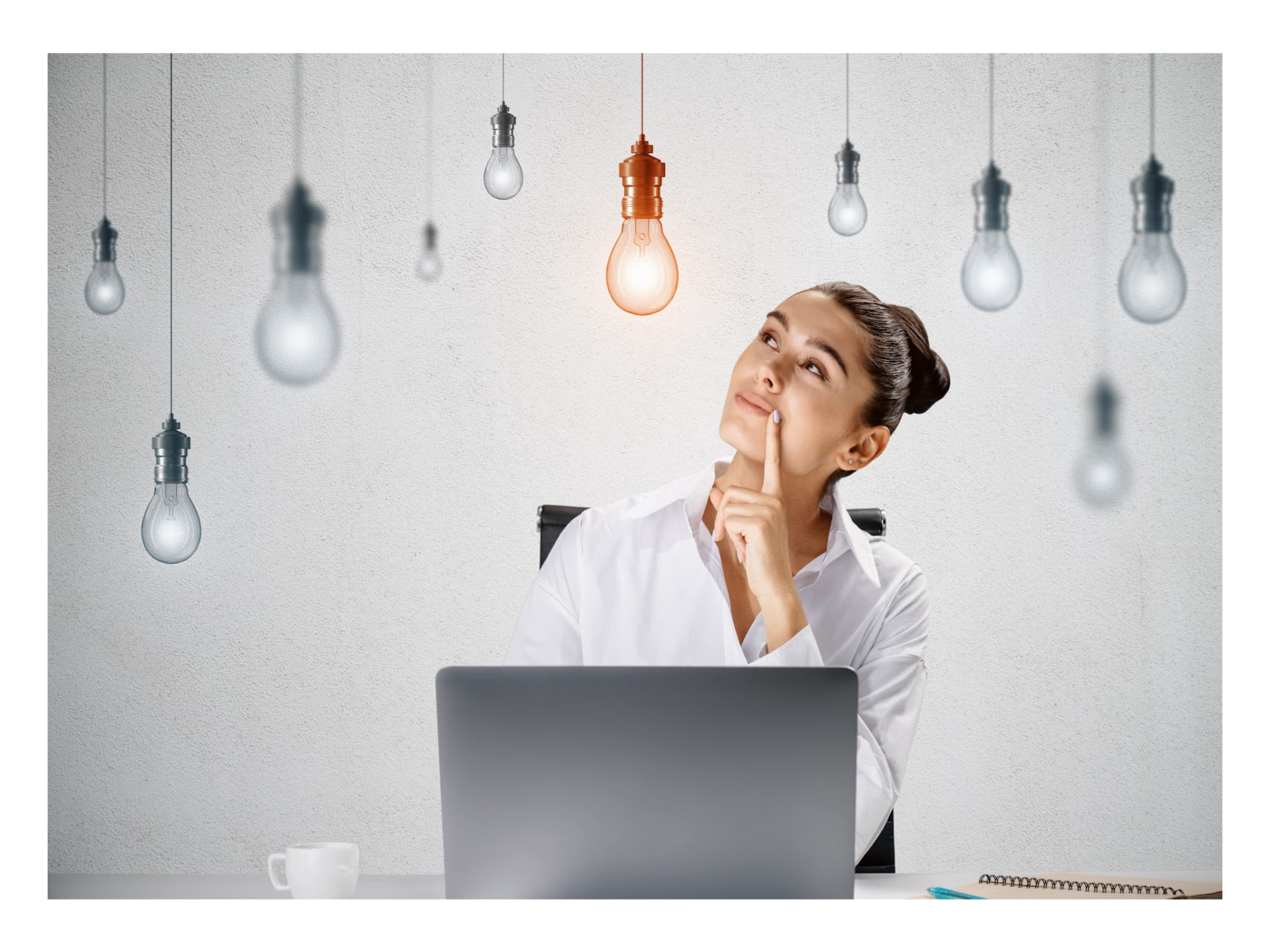 woman looking thoughtfully at lightbulb